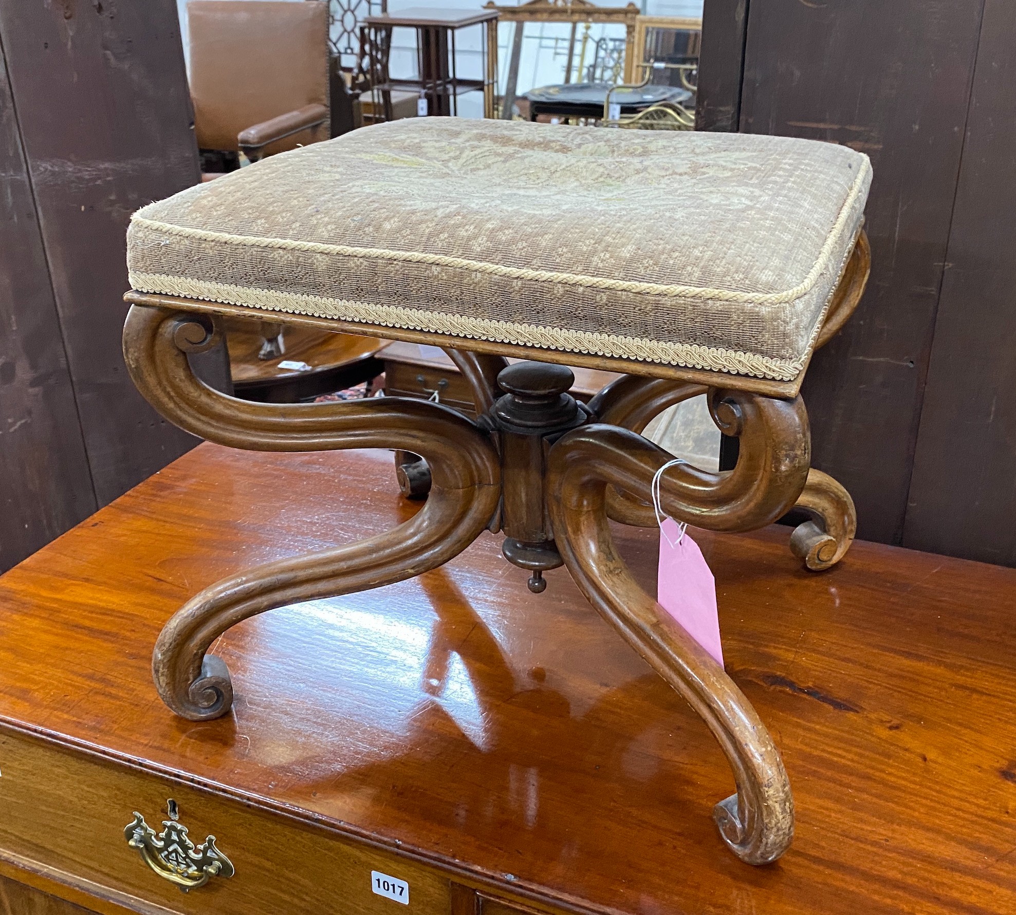 A Victorian carved mahogany X framed stool, length 49cm, depth 43cm, height 43cm